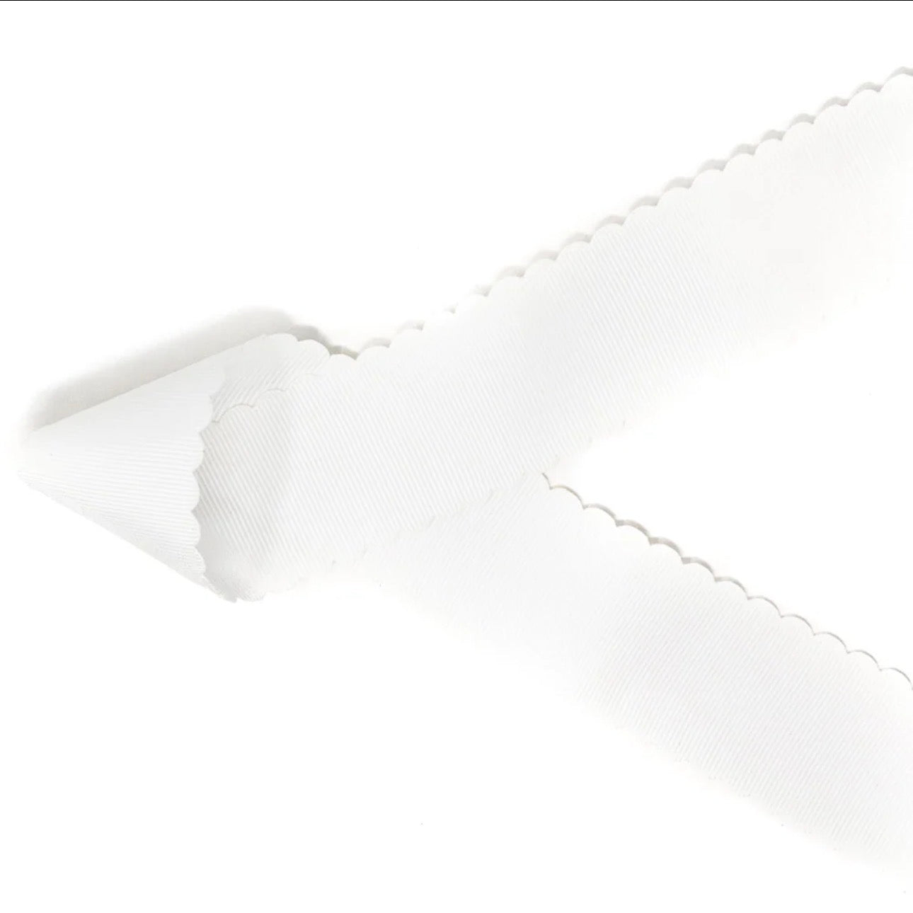 white scalloped bow