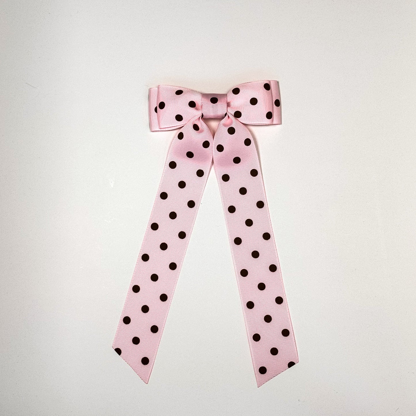 pink and brown polka dot bow