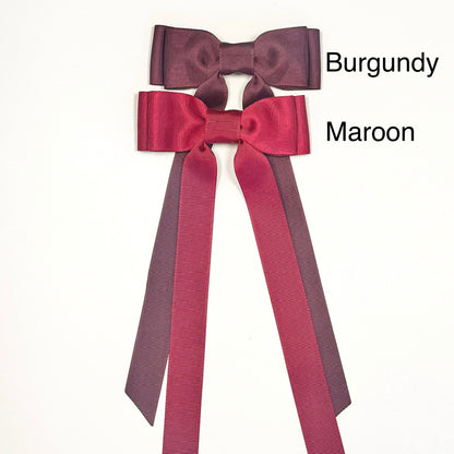 maroon bow