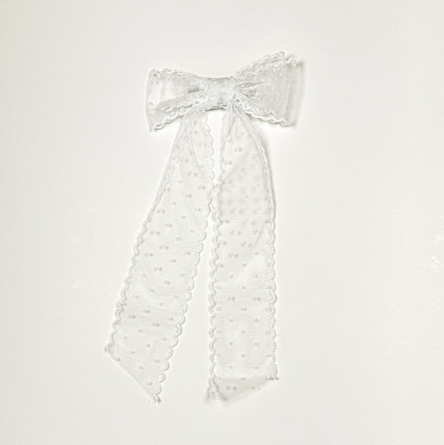 sheer white swiss dot bow