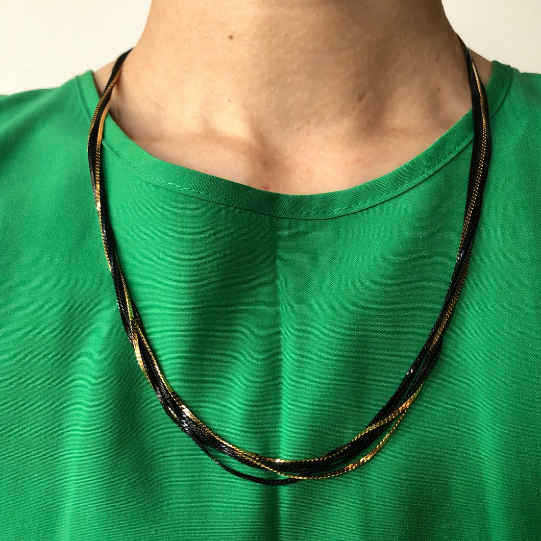 The gold/black multi chain necklace